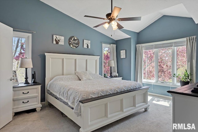 bedroom featuring lofted ceiling, ceiling fan, and light carpet
