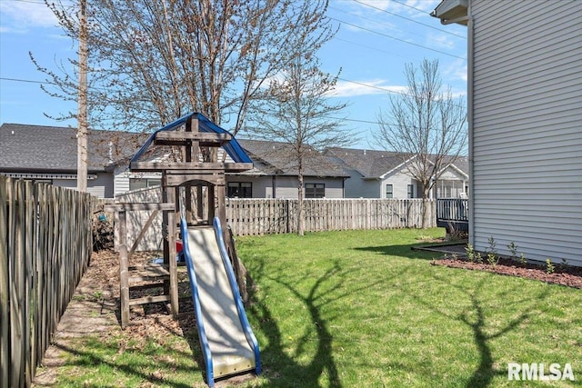 view of yard with a fenced backyard and a playground