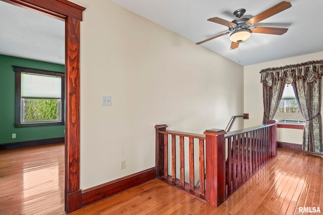 101 E Lester St, Williamsville, IL 62693 - stairs with wood finished floors, baseboards, and ceiling fan