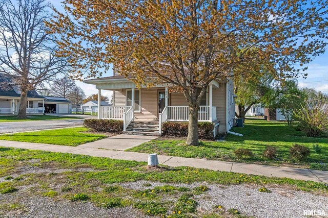 101 E Lester St, Williamsville, IL 62693 - view of front of home featuring a porch and a front yard