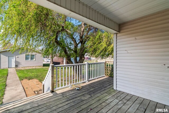 101 E Lester St, Williamsville, IL 62693 - wooden deck featuring a lawn