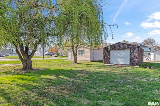 101 E Lester St, Williamsville, IL 62693 - view of yard featuring an outdoor structure and a detached garage