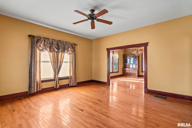 101 E Lester St, Williamsville, IL 62693 - empty room featuring baseboards, visible vents, and light wood-style floors