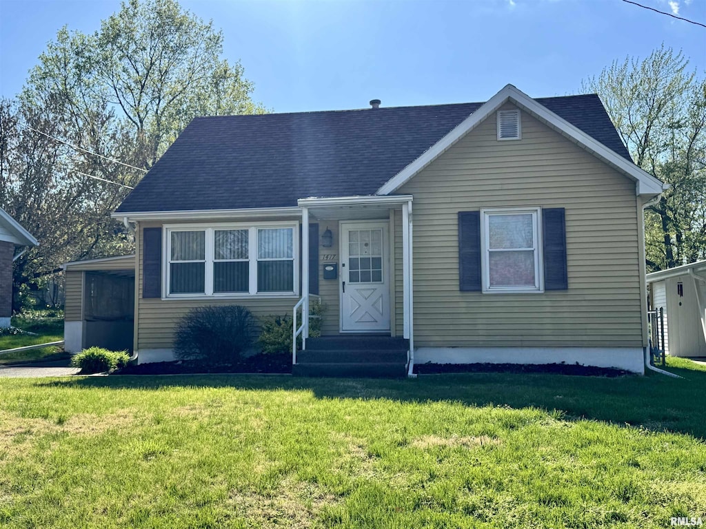 1417 N 20th St, Quincy, IL 62301 - view of front of home featuring a shingled roof and a front lawn
