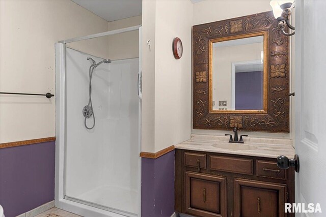 full bath featuring a shower stall and vanity