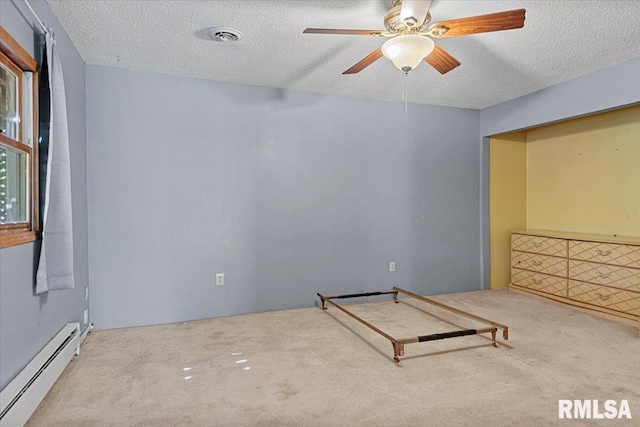 unfurnished bedroom featuring a textured ceiling, visible vents, carpet floors, and a baseboard radiator