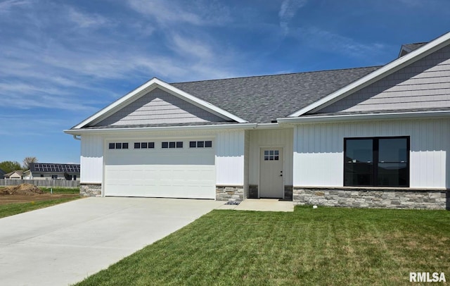 4621 Eugene Ct, Springfield, IL 62711 - view of front of home featuring concrete driveway, stone siding, an attached garage, a front yard, and roof with shingles