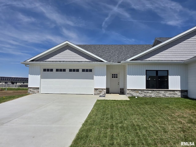 4621 Eugene Ct, Springfield, IL 62711 - view of front facade with a garage, stone siding, a shingled roof, and a front yard