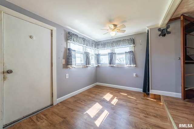 1620 N 703rd Ln, Liberty, IL 62347 - unfurnished bedroom with wood finished floors, a ceiling fan, baseboards, and ornamental molding