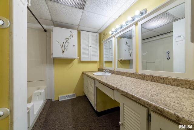 1620 N 703rd Ln, Liberty, IL 62347 - bathroom with bathtub / shower combination, vanity, a drop ceiling, and visible vents