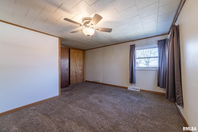 1620 N 703rd Ln, Liberty, IL 62347 - unfurnished room featuring carpet flooring, baseboards, visible vents, ceiling fan, and crown molding