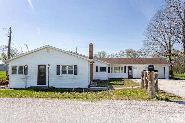 1620 N 703rd Ln, Liberty, IL 62347 - ranch-style house featuring an attached garage, a chimney, and driveway