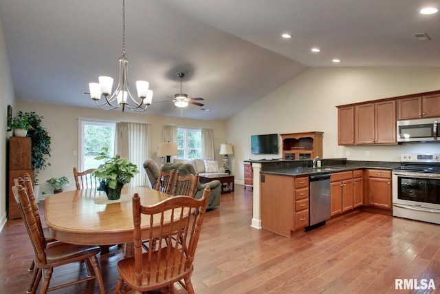515 Gardendale Dr, Quincy, IL 62301 - kitchen featuring lofted ceiling, light wood finished floors, visible vents, appliances with stainless steel finishes, and open floor plan