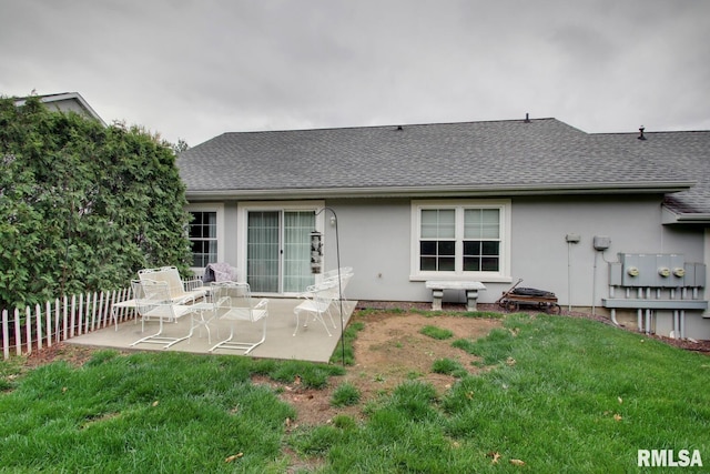 515 Gardendale Dr, Quincy, IL 62301 - rear view of house featuring stucco siding, a shingled roof, a patio, and fence