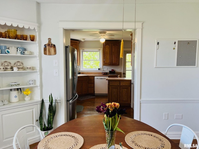 kitchen with electric panel, dark wood-style floors, freestanding refrigerator, a ceiling fan, and dishwasher