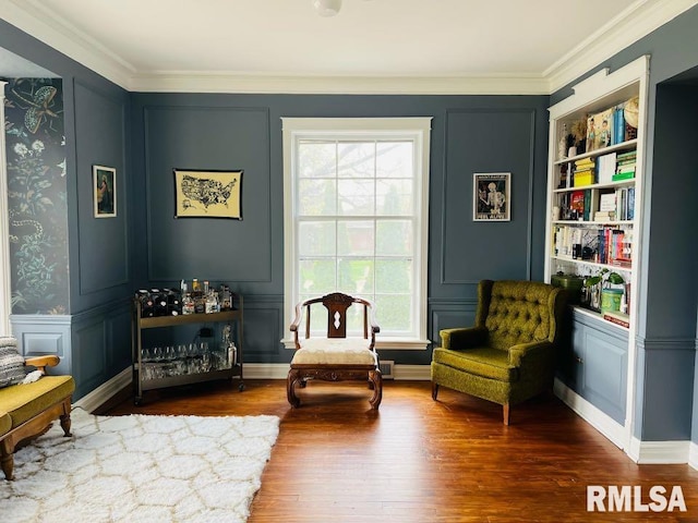 603 Country Club Dr, Hannibal-Mo, MO 63401 - living area with a decorative wall, healthy amount of natural light, wood finished floors, ornamental molding, and built in features