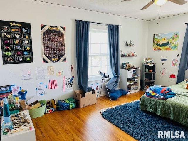 bedroom with ceiling fan and wood finished floors