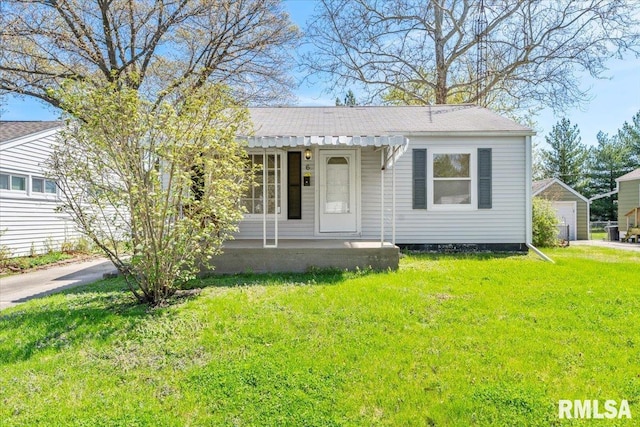bungalow-style house with a front yard