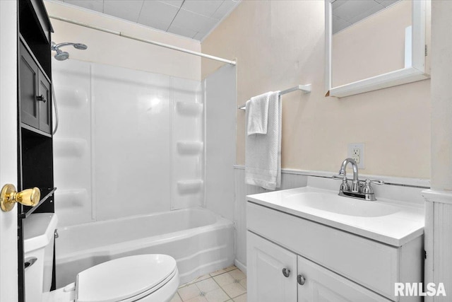 bathroom with toilet, vanity, and bathtub / shower combination