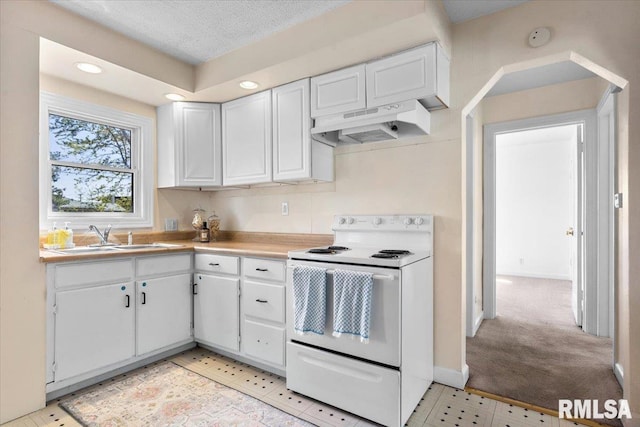 kitchen featuring white electric stove, under cabinet range hood, light countertops, a sink, and white cabinetry