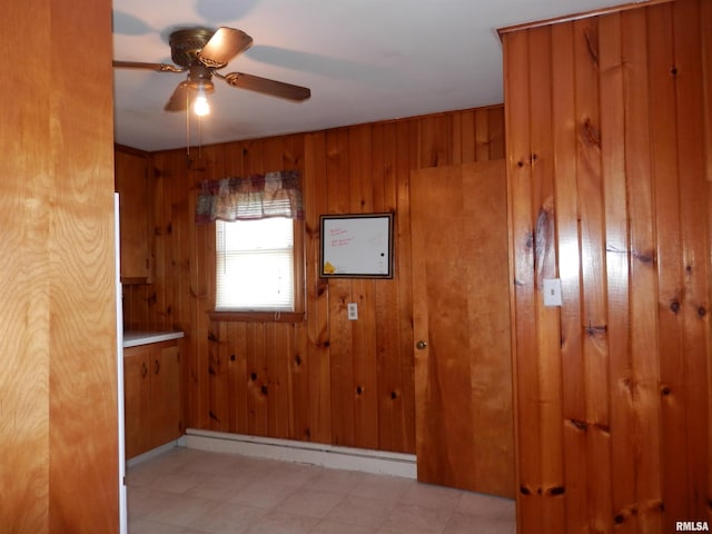 515 Franklin Ave, Galesburg, IL 61401 - empty room with a ceiling fan and wood walls