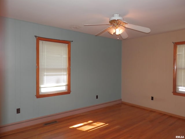 515 Franklin Ave, Galesburg, IL 61401 - unfurnished room with wood finished floors, ceiling fan, and baseboards
