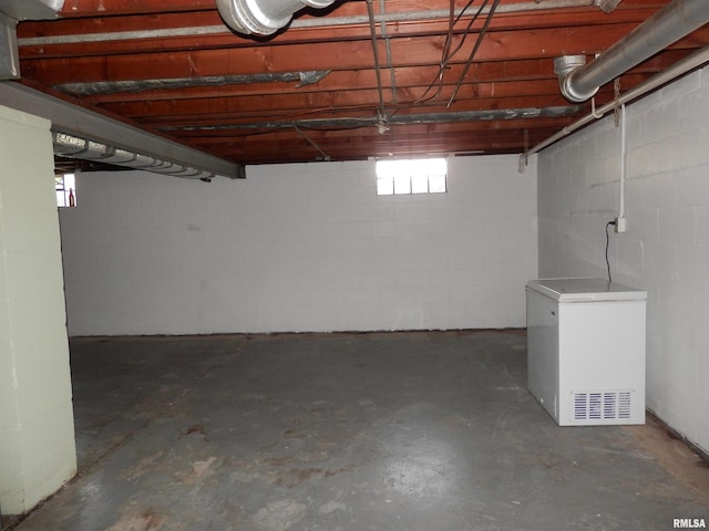 515 Franklin Ave, Galesburg, IL 61401 - below grade area featuring fridge and concrete block wall