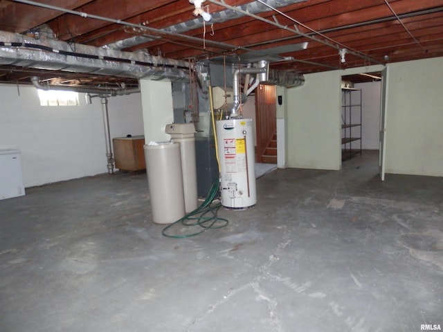 515 Franklin Ave, Galesburg, IL 61401 - basement featuring water heater, a water softener system, stairway, and fridge