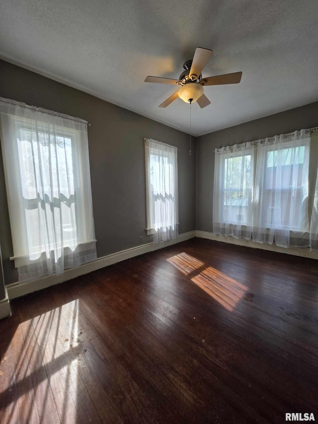 419 S 16th St, Quincy, IL 62301 - empty room with wood-type flooring, a textured ceiling, baseboards, and ceiling fan