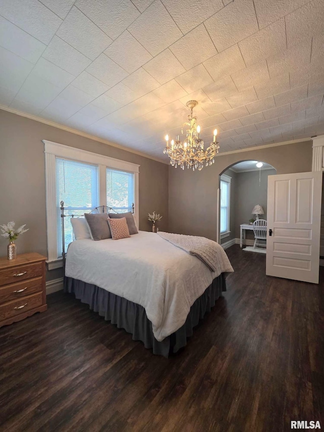 419 S 16th St, Quincy, IL 62301 - bedroom featuring multiple windows, arched walkways, ornamental molding, and dark wood finished floors