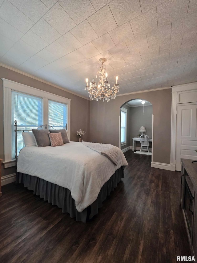 419 S 16th St, Quincy, IL 62301 - bedroom with multiple windows, ornamental molding, and dark wood-style flooring