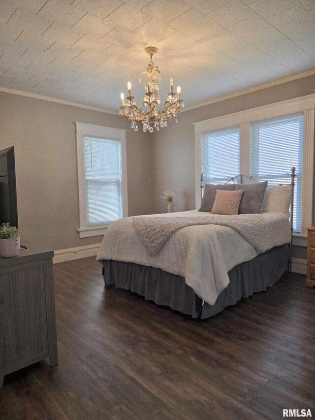 419 S 16th St, Quincy, IL 62301 - bedroom featuring a notable chandelier, dark wood-style flooring, crown molding, and baseboards