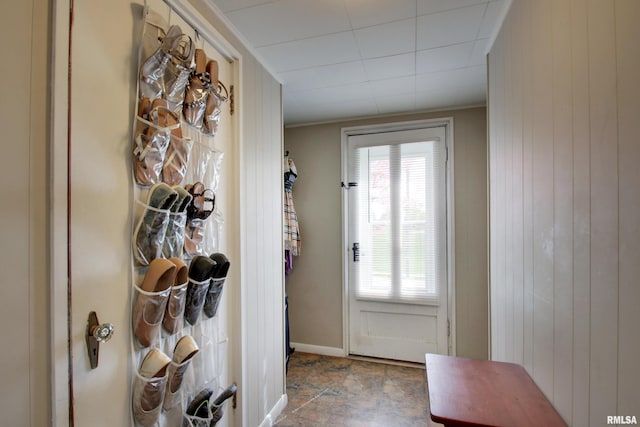 344 S State Rd, Mendon, IL 62351 - doorway with stone finish flooring, wood walls, ornamental molding, and baseboards