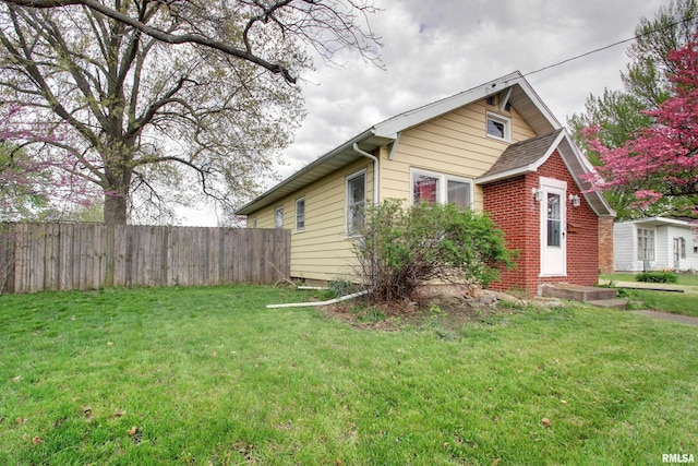 344 S State Rd, Mendon, IL 62351 - exterior space with fence, brick siding, and a front yard