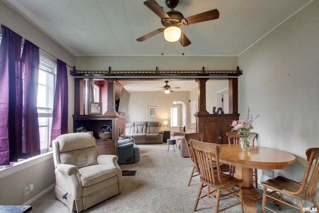 344 S State Rd, Mendon, IL 62351 - dining room featuring arched walkways, crown molding, a ceiling fan, and light carpet