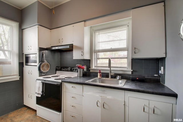 344 S State Rd, Mendon, IL 62351 - kitchen with under cabinet range hood, dark countertops, a sink, and white range with electric stovetop