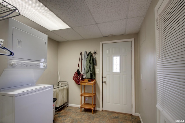 344 S State Rd, Mendon, IL 62351 - laundry room with stacked washer / drying machine, baseboards, and laundry area