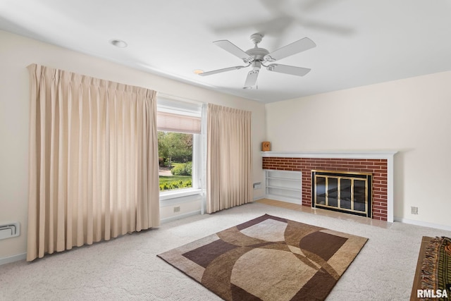 unfurnished living room with a fireplace, baseboards, carpet, and a ceiling fan