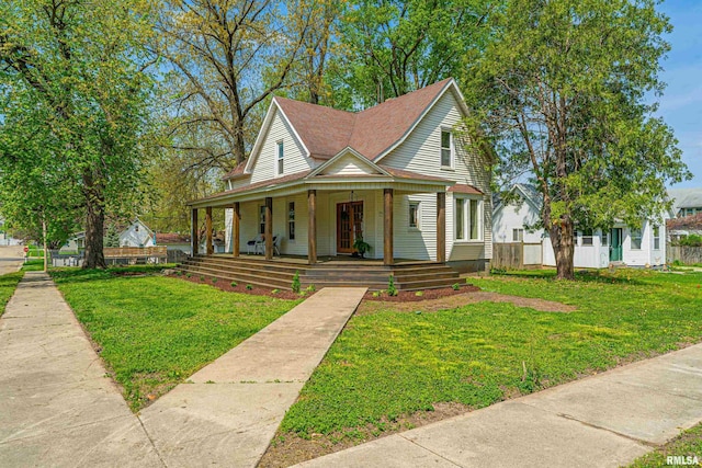 203 Oglesby Ave, Lincoln, IL 62656 - view of front facade featuring a porch, a front yard, and fence