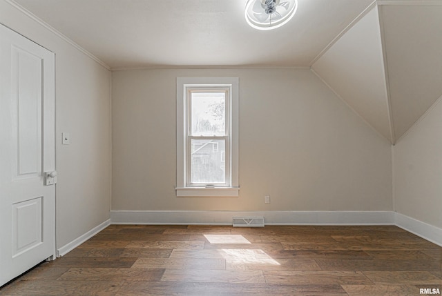 203 Oglesby Ave, Lincoln, IL 62656 - bonus room with baseboards, vaulted ceiling, visible vents, and dark wood-style flooring