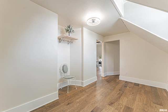 203 Oglesby Ave, Lincoln, IL 62656 - bonus room featuring baseboards and wood finished floors