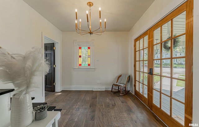 203 Oglesby Ave, Lincoln, IL 62656 - interior space with visible vents, an inviting chandelier, a healthy amount of sunlight, and wood-type flooring