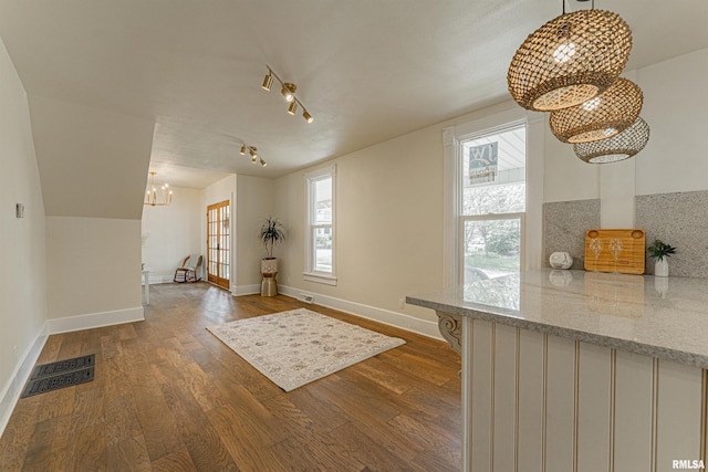 203 Oglesby Ave, Lincoln, IL 62656 - interior space featuring dark wood finished floors, an inviting chandelier, visible vents, and baseboards