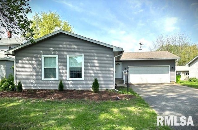 ranch-style home featuring an attached garage, a front lawn, and driveway
