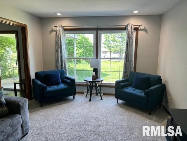living area with recessed lighting and carpet floors