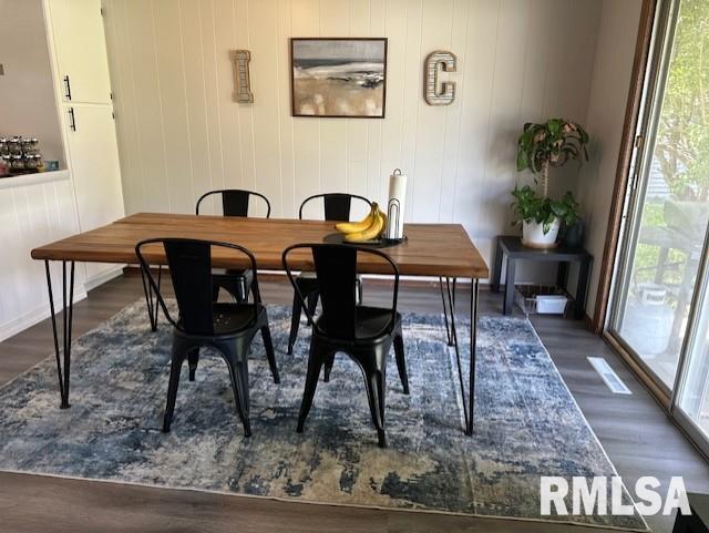 dining room with wood finished floors