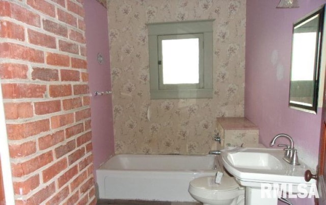 212 Main St, Franklin, IL 62638 - full bathroom featuring a tub, toilet, wallpapered walls, and a sink