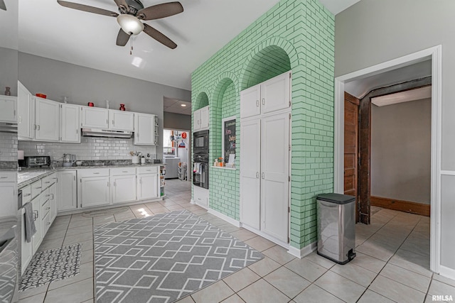 kitchen featuring black appliances, a ceiling fan, white cabinets, and under cabinet range hood