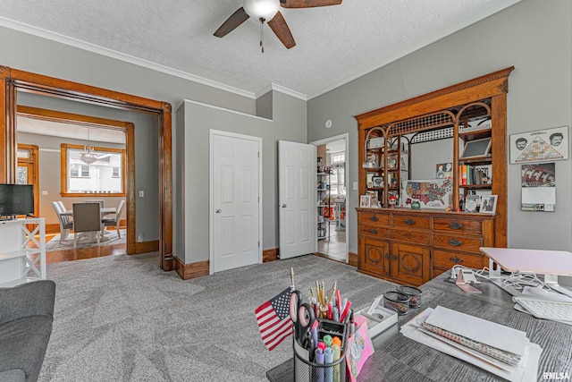bedroom featuring a textured ceiling, crown molding, ceiling fan, baseboards, and carpet