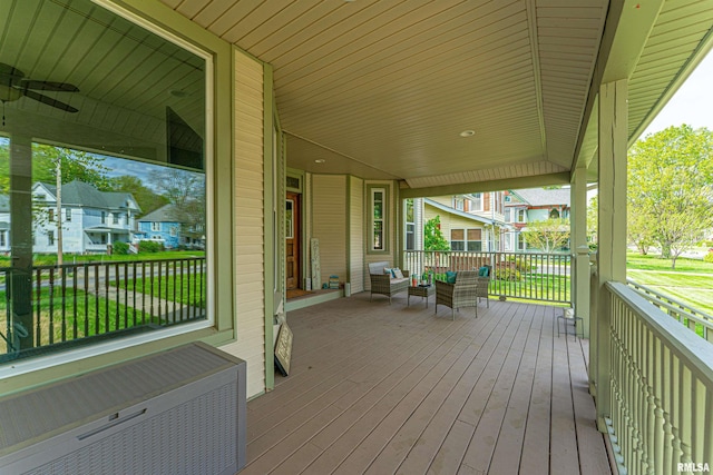 deck featuring an outdoor living space and ceiling fan